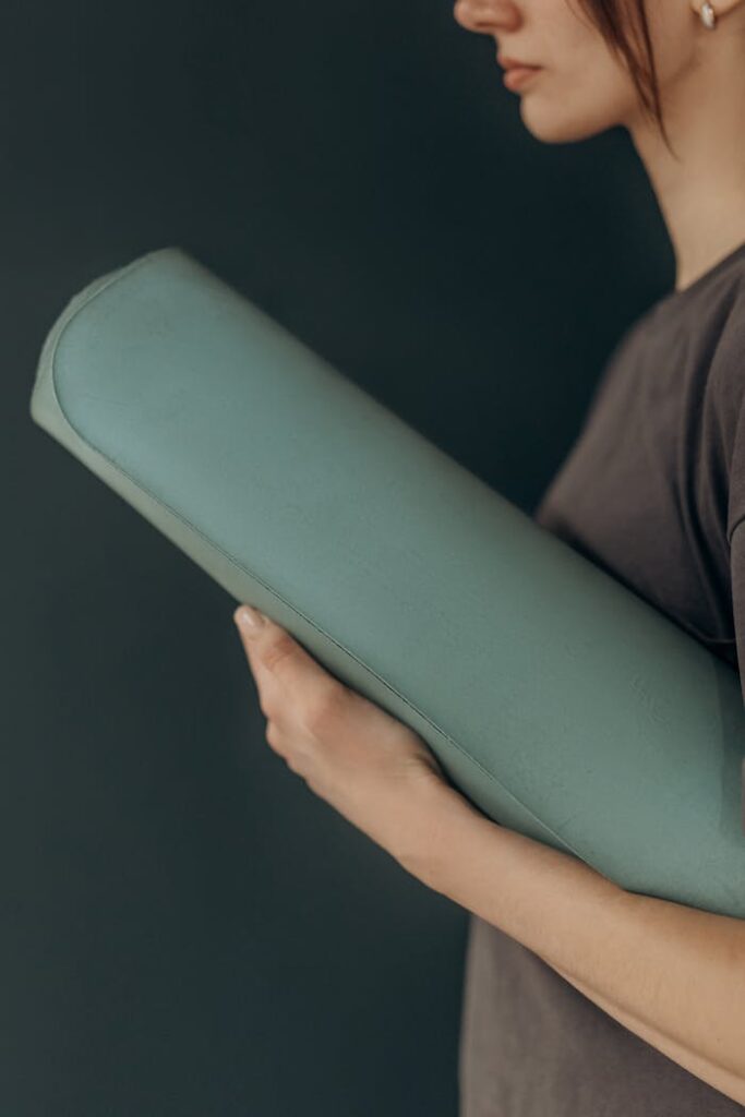 Woman Holding A Yoga Mat